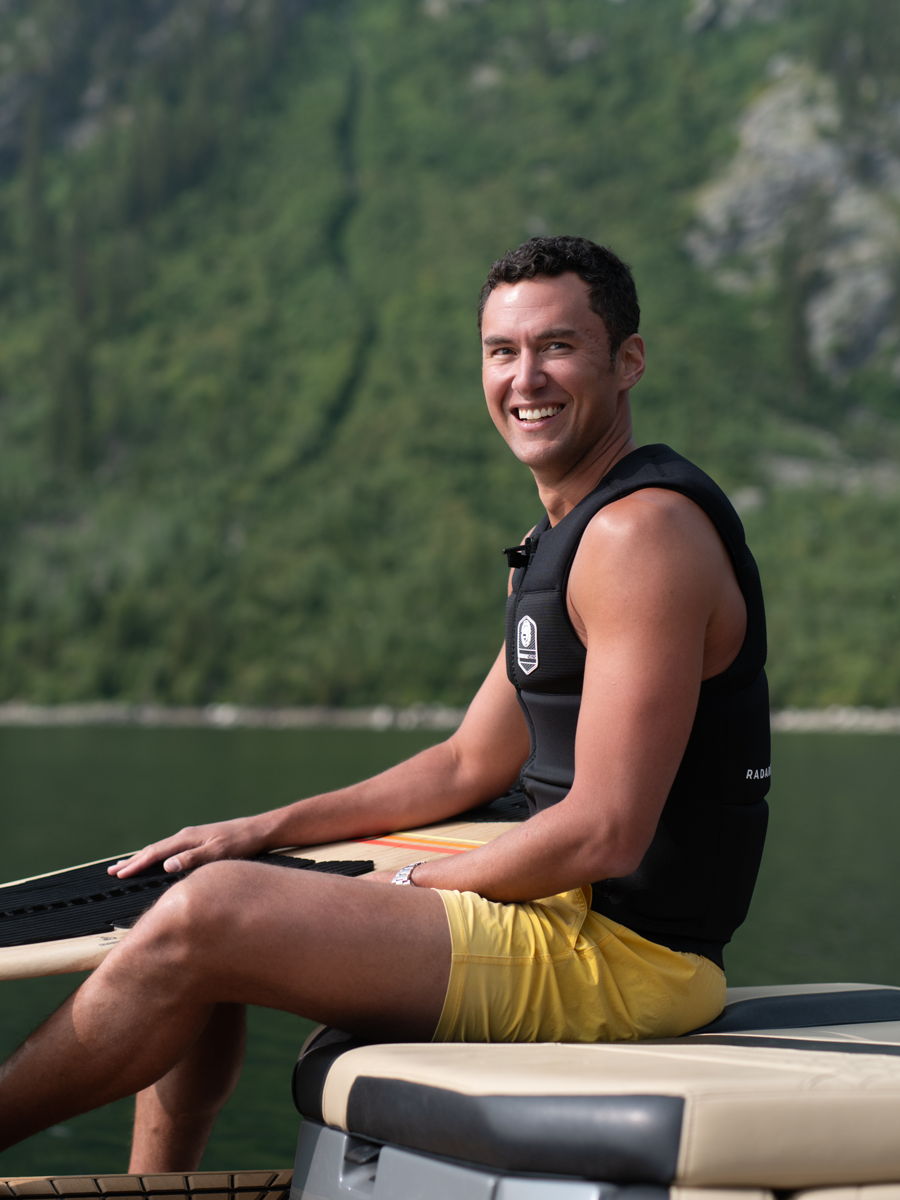 Mekki Jaidi paddleboarding on a lake in Jackson Hole