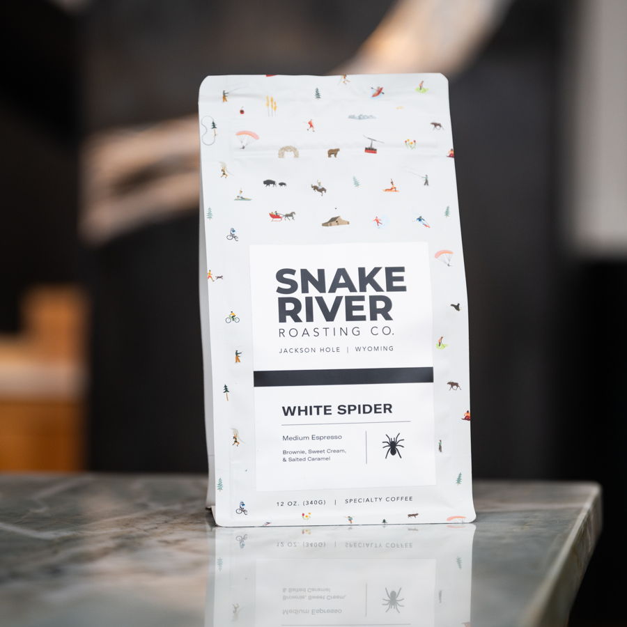 A bag of White Spider on the counter with beans scattered around it