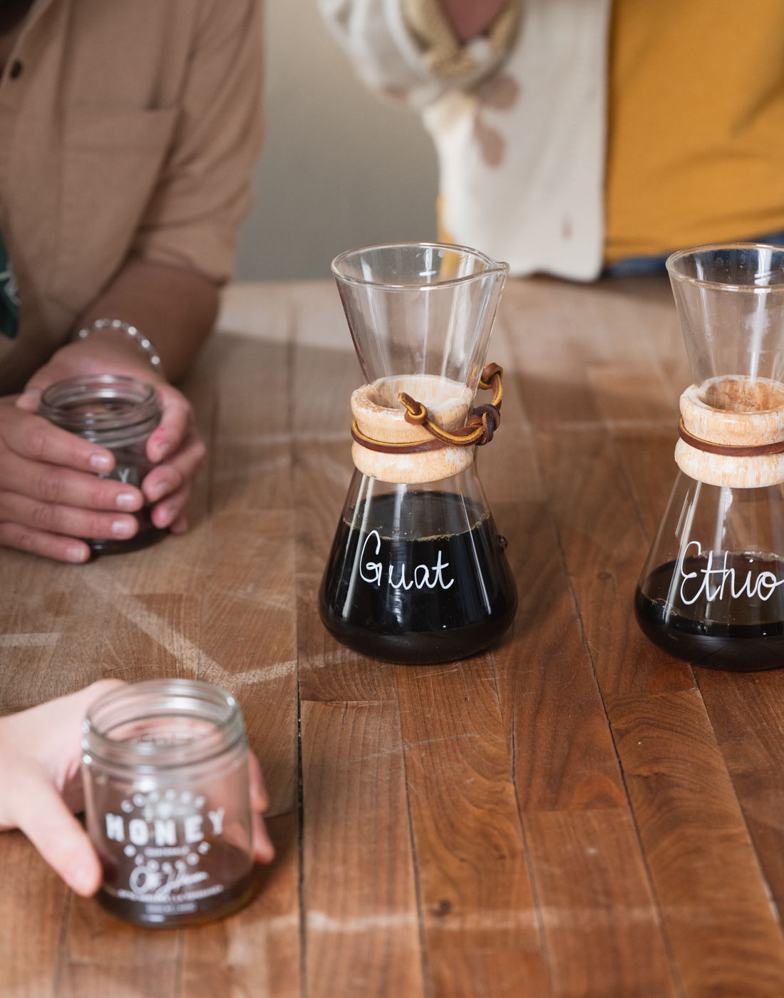 A line of chemex brewers mid-pour